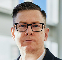 CEO and executive of a crypto trading company, Alexander Hughes, headshot